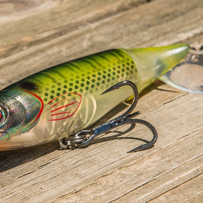 Shad colored whopper plopper 95 on a wooden plank in the sun